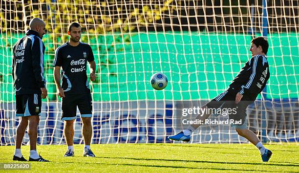 Argentina's Sebastian Veron, Javier Mascherano and Lionel Messi during a training session at the Asociacion Argentina de Futbol facilities on June 4,...