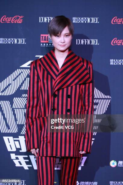 Singer Chris Lee arrives at the red carpet of L'Officiel Fashion Night 2017 on November 29, 2017 in Beijing, China.