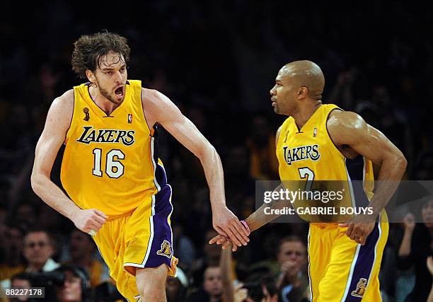 Los Angeles Lakers forward Pau Gasol of Spain and guard Derek Fisher react during Game 1 of the NBA Finals against the Orlando Magic at the Staples...