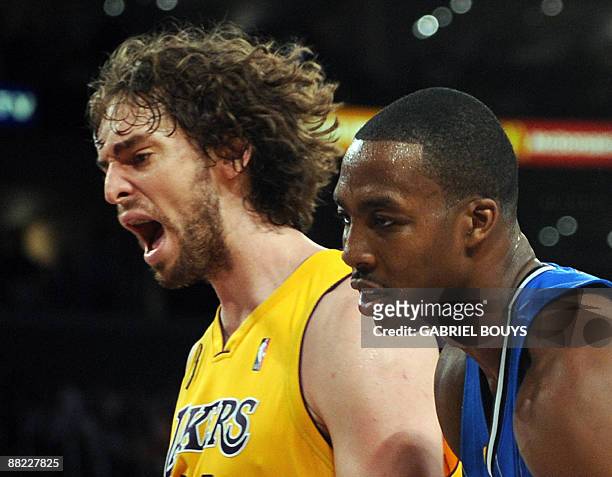 Los Angeles Laker forward Pau Gasol from Spain reacts beside Orlando Magic center Dwight Howard during Game 1 of the NBA Finals at the Staples Center...