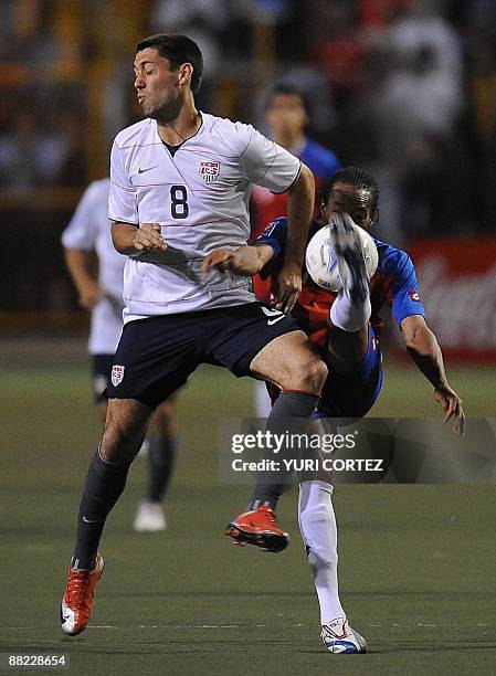 Costa Rican Junior Diaz fights for the ball with US Clinton Demsey during their FIFA World Cup South Africa-2010 qualifier on June 3, 2009 at the...