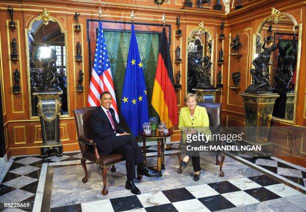 President Barack Obama chats with German Chancellor Angela Merkel during a bilateral meeting in the "Gruenes Gewoelbe" at Dresden Castle on June 5,...