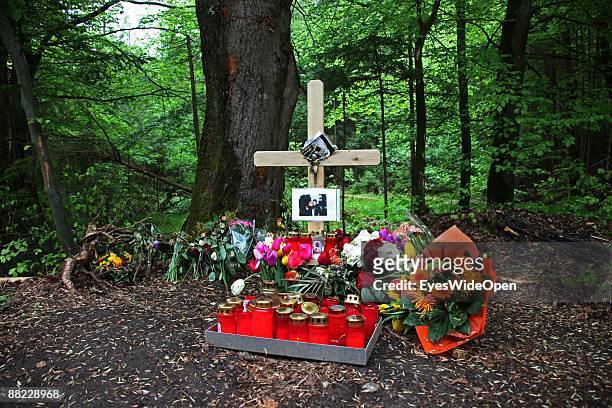 Flowers and a cross remember two friends that died in a car accident some days before, Ebersberg on June 04 Germany.
