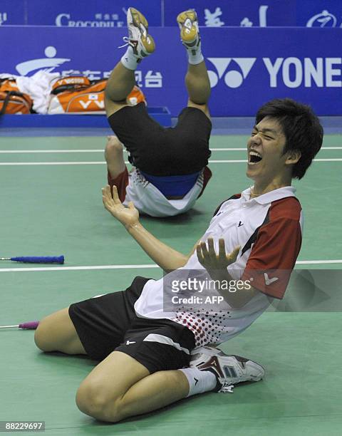 South Korea's Lee Yong Dae and Jung Jae Sung celebrate their win over Indonesia's Hendra Setiawan and Mohammad Ahsan during the men's doubles...