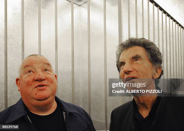 Former French Culture minister Jack Lang is guided by artist Claude Leveque during a visit in his installation "Le grand soir" at the French pavilion...