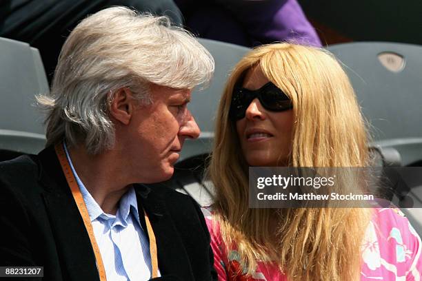 Former Swedish tennis player Bjorn Borg and his wife Patricia Ostfeldt watch the action during the Men's Singles Semi Final match between Robin...