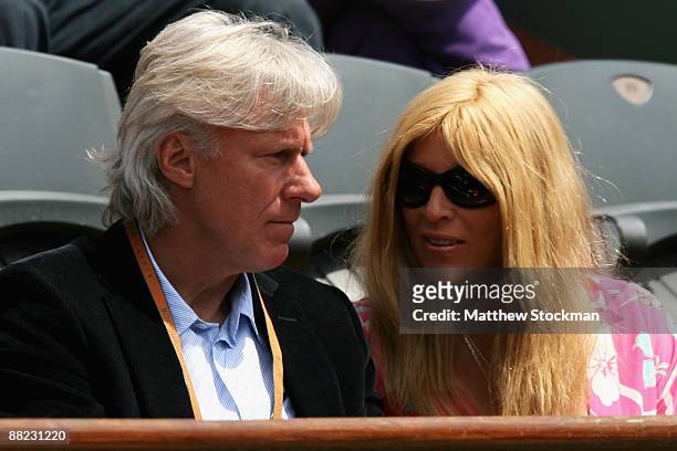 Former Swedish tennis player Bjorn Borg and his wife Patricia Ostfeldt watch the action during the Men's Singles Semi Final match between Robin...