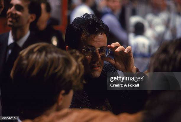 American actor Sylvester Stallone attends an LA Kings ice hockey game at the Forum, Los Angeles, California, January 1991.