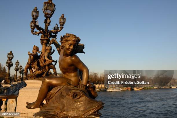 The Pont Alexandre III is an arch bridge that spans the Seine, connecting the Champs-Élysées quarter and the Invalides and Eiffel Tower quarter. It...