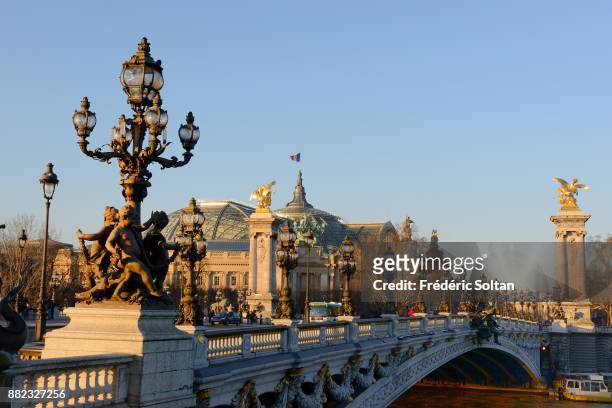 The Pont Alexandre III is an arch bridge that spans the Seine, connecting the Champs-Élysées quarter and the Invalides and Eiffel Tower quarter. It...