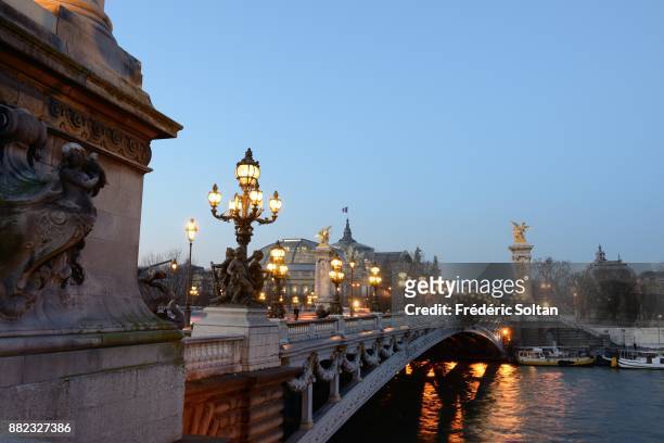 The Pont Alexandre III is an arch bridge that spans the Seine, connecting the Champs-Élysées quarter and the Invalides and Eiffel Tower quarter. It...