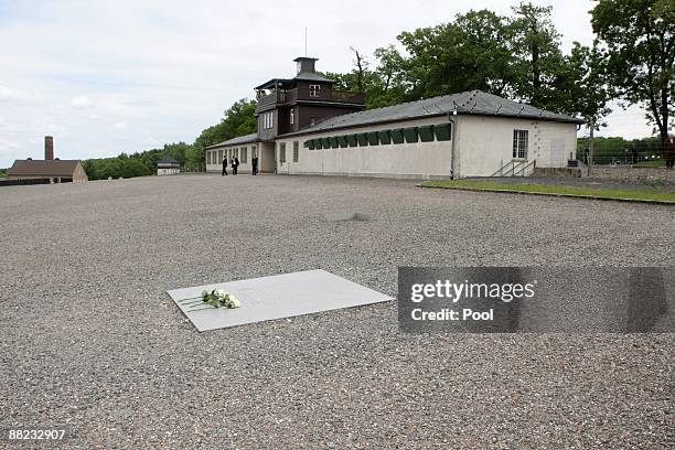 White roses lay on a memorial board at the former Buchenwald concentration camp on June 5, 2009 near Weimar, Germany. Obama is visiting the site...