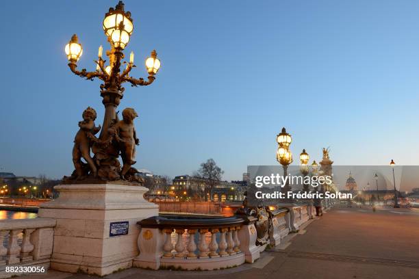 The Pont Alexandre III is an arch bridge that spans the Seine, connecting the Champs-Élysées quarter and the Invalides and Eiffel Tower quarter. It...