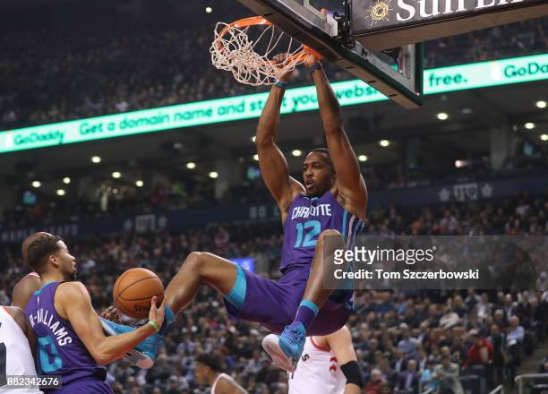 Dwight Howard of the Charlotte Hornets dunks the ball against the Toronto Raptors during NBA game action at Air Canada Centre on November 29, 2017 in...