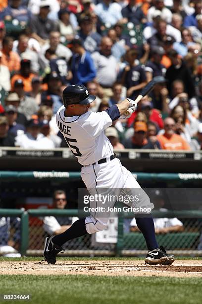 Brandon Inge of the Detroit Tigers hits a 2 RBI single during the game between the Boston Red Sox and the Detroit Tigers in Detroit, Michigan at...