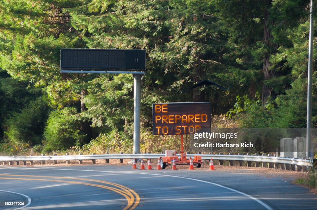 Illuminated road work sign on California Highway 101 north through Del Norte County warning be prepared to stop