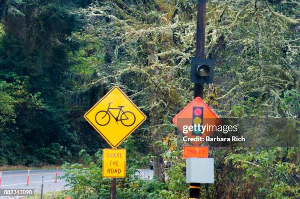 stop signal warning and share the road signs on california highway 101 north through del norte county warning be prepared to stop - condado del norte imagens e fotografias de stock