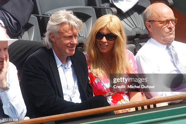 Former Swedish tennis player Bjorn Borg and his wife Patricia Ostfeldt watch the action at Roland Garros on June 5, 2009 in Paris, France.