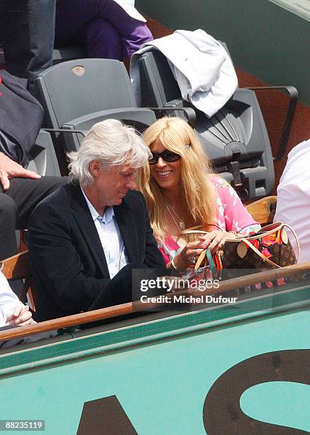 Former Swedish tennis player Bjorn Borg and his wife Patricia Ostfeldt watch the action at Roland Garros on June 5, 2009 in Paris, France.