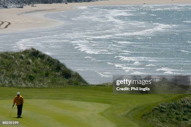 Costantino Rocca of Italy waits to putt on the 11th hole during the first round of the Irish Seniors Open played at the Old Course Ballylbunion on...