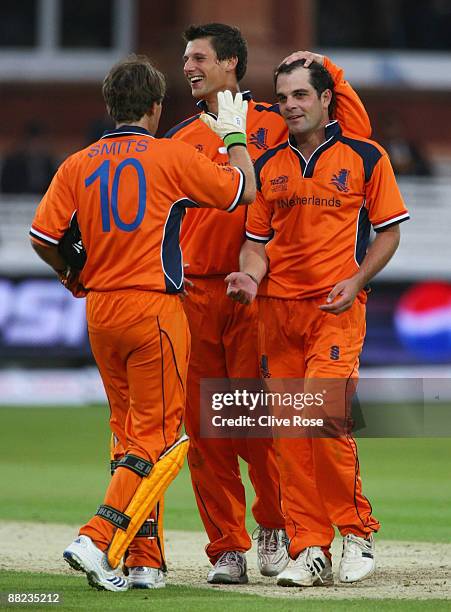 Peter Borren of Netherlands celebrates the wicket of Eoin Morgan of England with captain Jeroen Smits during the ICC World Twenty20 Group B match...