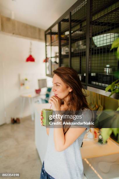 healthy start of the day - woman drinking smoothie stock pictures, royalty-free photos & images