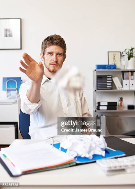man at his desk in his office - throwing crumpled paper stock pictures, royalty-free photos & images