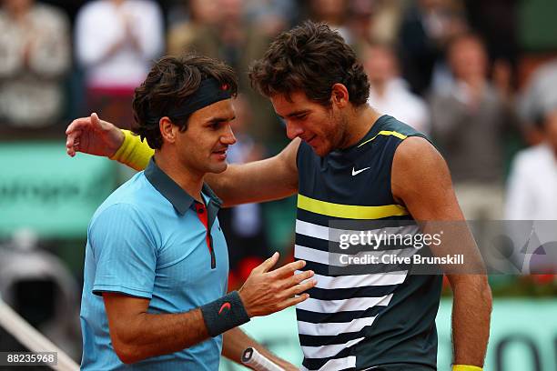 Roger Federer of Switzerland is congratulated by Juan Martin Del Potro of Argentina following his victory during the Men's Singles Semi Final matchon...