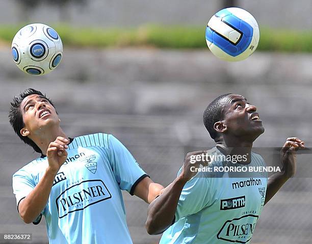 Ecuadorean national team footballers Cristian Noboa and Neicer Reascos, take part in a training session at the military school Eloy Alfaro in Quito,...