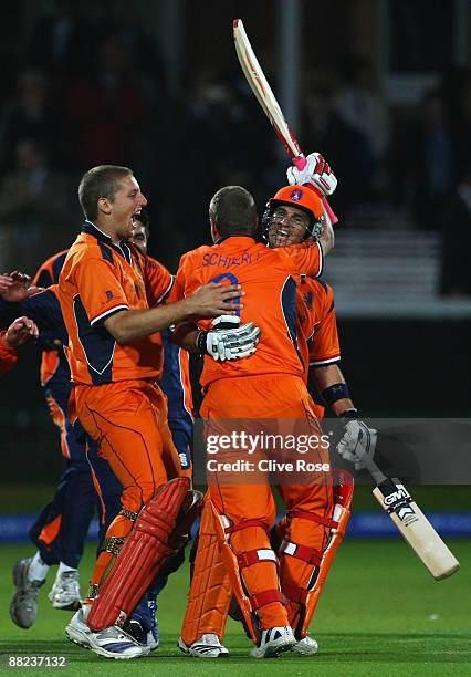 Ryan ten Doeschate of Netherlands celebrates victory with Edgar Schiferli and Daan van Bunge after the ICC World Twenty20 Group B match between...