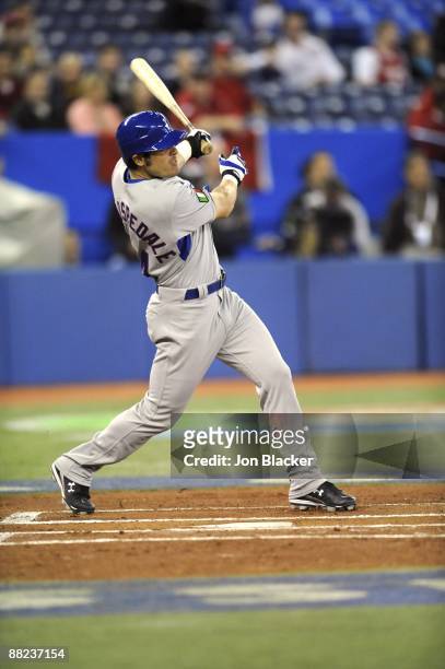 Davide Dallospedale of Team Italy bats during the Pool C, game four between Canada and Italy during the first round of the 2009 World Baseball...