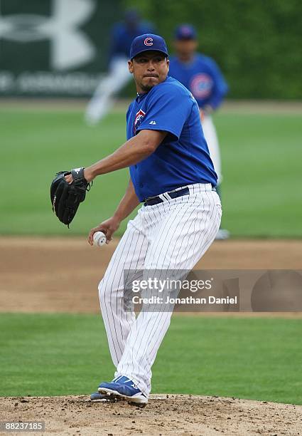 Starting pitcher Carlos Zambrano of the Chicago Cubs delivers the ball against the Pittsburgh Pirates on May 27, 2009 at Wrigley Field in Chicago,...