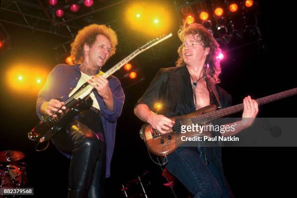Paul Dean, left, and Scott Smith of the band Loverboy perform at The Meadowlands Arena in East Rutherford, New Jersey, February 14, 1986.