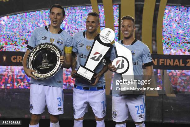 Geromel , Luan and Arthur pose with trophies after the second leg match between Lanus and Gremio as part of Copa Bridgestone Libertadores 2017 Final...