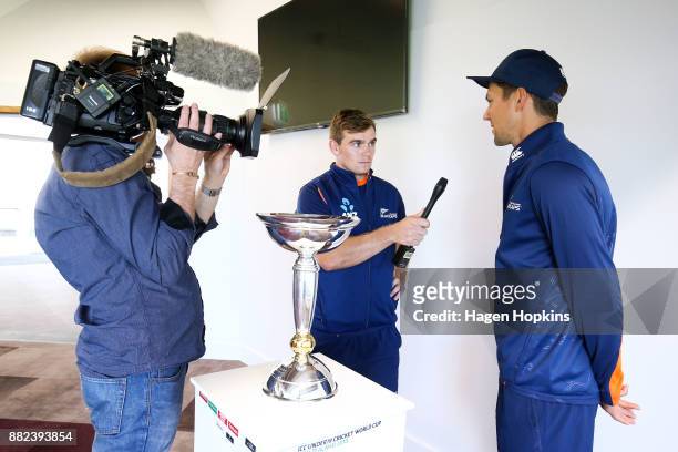 Tom Latham of New Zealand interviews teammate Trent Boult during a New Zealand U19 ICC World Cup Media Opportunity at Basin Reserve on November 30,...