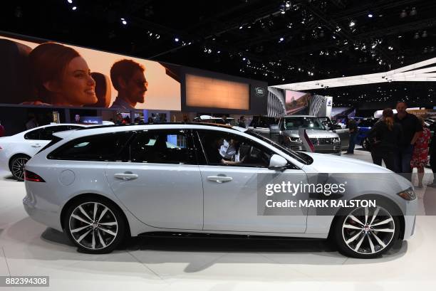 The exterior of the new Jaguar XF Sportbrake wagon on display at the 2017 LA Auto Show in Los Angeles, California on November 29, 2017. / AFP PHOTO /...