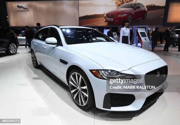 The exterior of the new Jaguar XF Sportbrake wagon on display at the 2017 LA Auto Show in Los Angeles, California on November 29, 2017. / AFP PHOTO /...