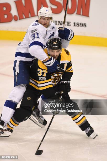 Patrice Bergeron of the Boston Bruins against Steven Stamkos of the Tampa Bay Lightning at the TD Garden on November 29, 2017 in Boston,...