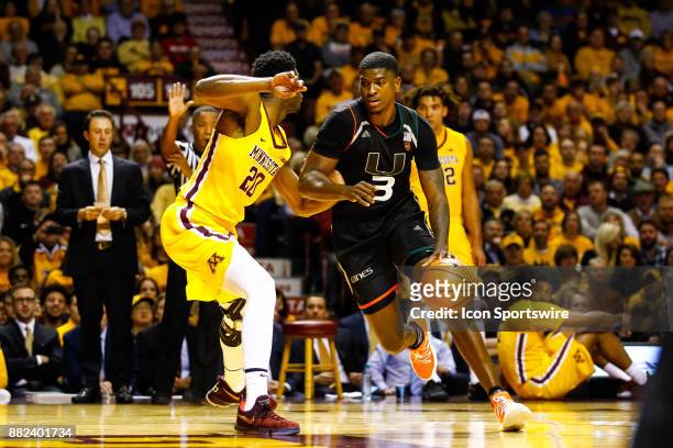 Miami Hurricanes guard Anthony Lawrence II drives to the net while Minnesota Golden Gophers forward Davonte Fitzgerald defends during the...