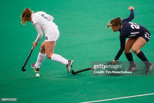 Grace Jennings of Middlebury College loses possession of the ball past Morgan Vasiliu of Messiah College during the Division III Women's Field Hockey...