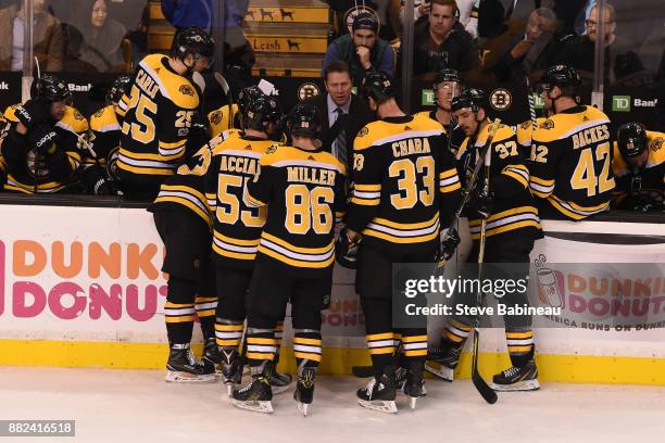 Assistant Coach Joe Sacco of the Boston Bruins talks to his team during the third period against the Tampa Bay Lightning at the TD Garden on November...