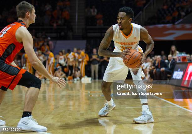 Tennessee Volunteers guard Jordan Bowden looks to drive the ball on Mercer Bears guard Ethan Stair during a game between the Mercer Bears and...