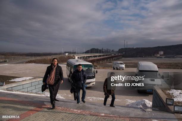 In a photo taken on November 21 people arrive on the North Korean side of the border between North Korea and China and the entrance to the Rason...