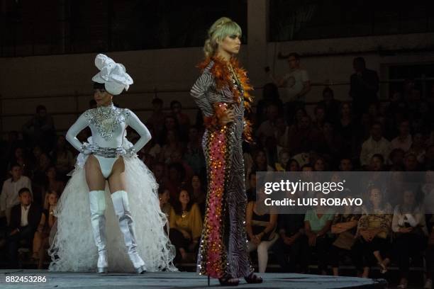 Members of the LGBTI community model a creation by Colombian designer Diego Morales during the Walkway Inclusion fashion show in Cali, Colombia on...