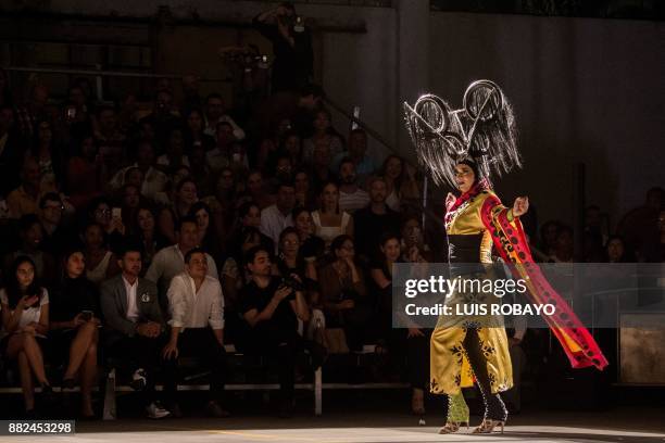 Man of the LGBTI community models a creation by Colombian designer Diego Morales during the Walkway Inclusion fashion show in Cali, Colombia on...