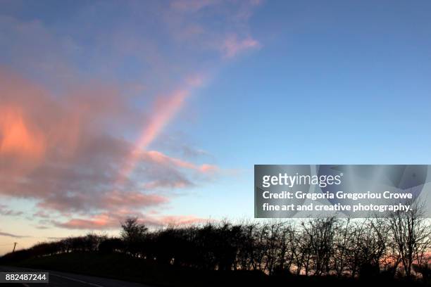 cloud typologies - sunrise and rainbow sky - gregoria gregoriou crowe fine art and creative photography. imagens e fotografias de stock