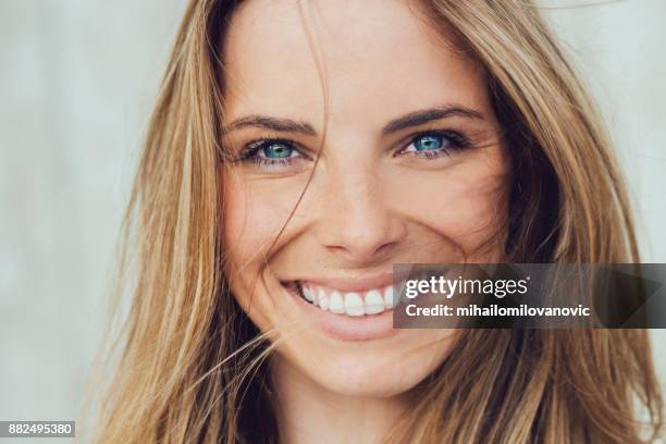 happiness - woman blue eyes stock pictures, royalty-free photos & images