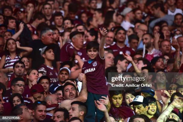 Kid cheers in the crowd during the second leg match between Lanus and Gremio as part of Copa Bridgestone Libertadores 2017 Final at Ciudad de Lanus...