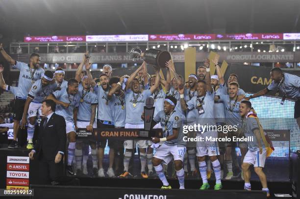 Geromel of Gremio and teammates lift the champions trophy after the second leg match between Lanus and Gremio as part of Copa Bridgestone...