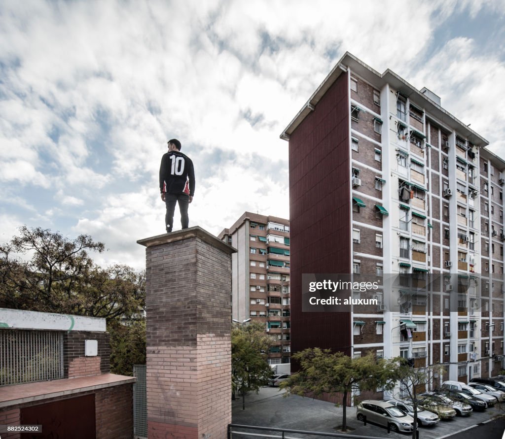 Man practicing parkour in city suburbia